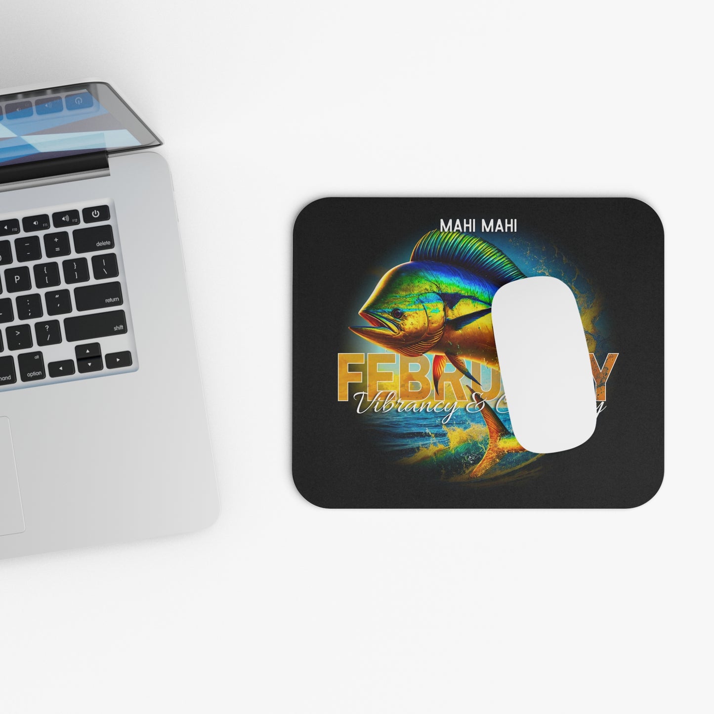 February birth month mouse pad with vibrant Mahi Mahi fish design by Printify next to laptop