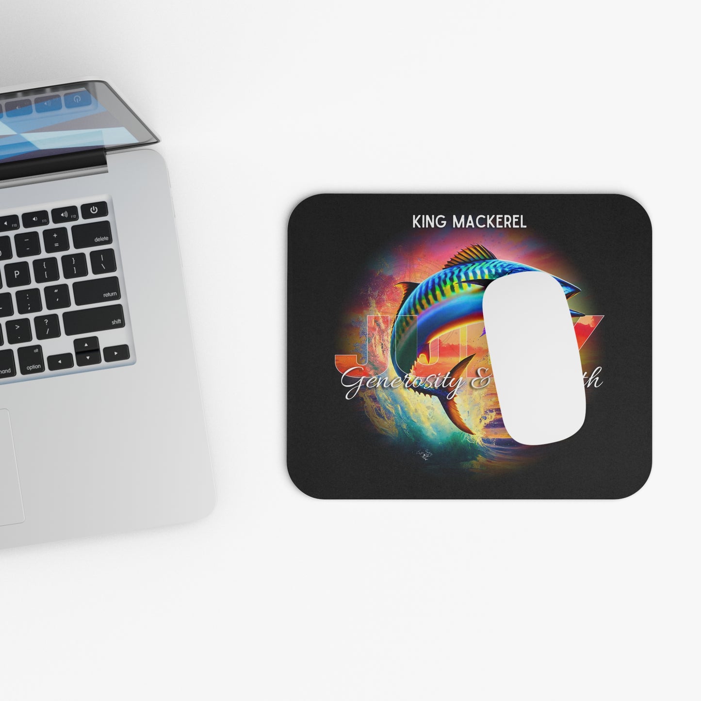 Birth month mouse pad featuring colorful King Mackerel design beside laptop and white mouse