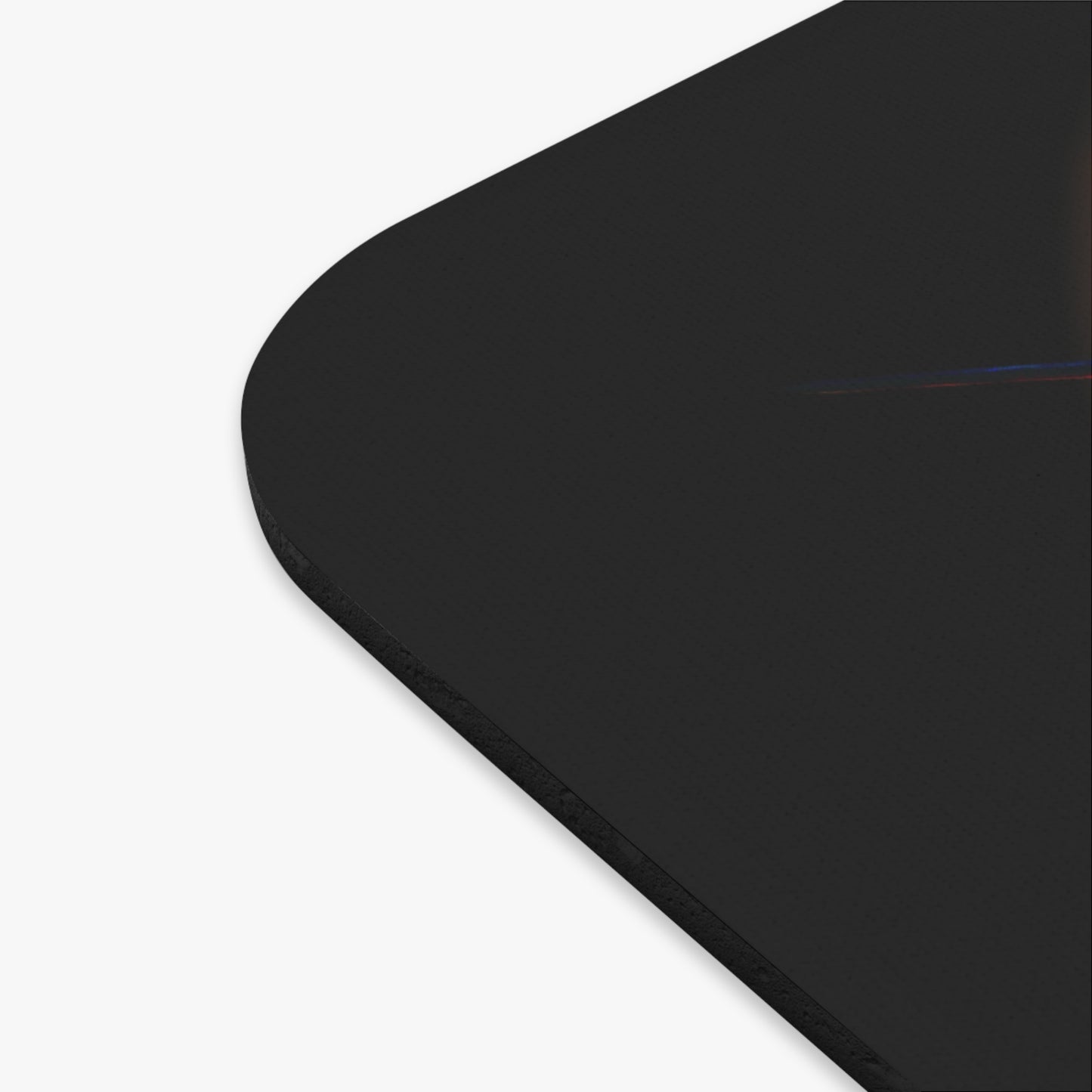 Close-up of black birth month mouse pad corner with smooth rounded edge for home decor