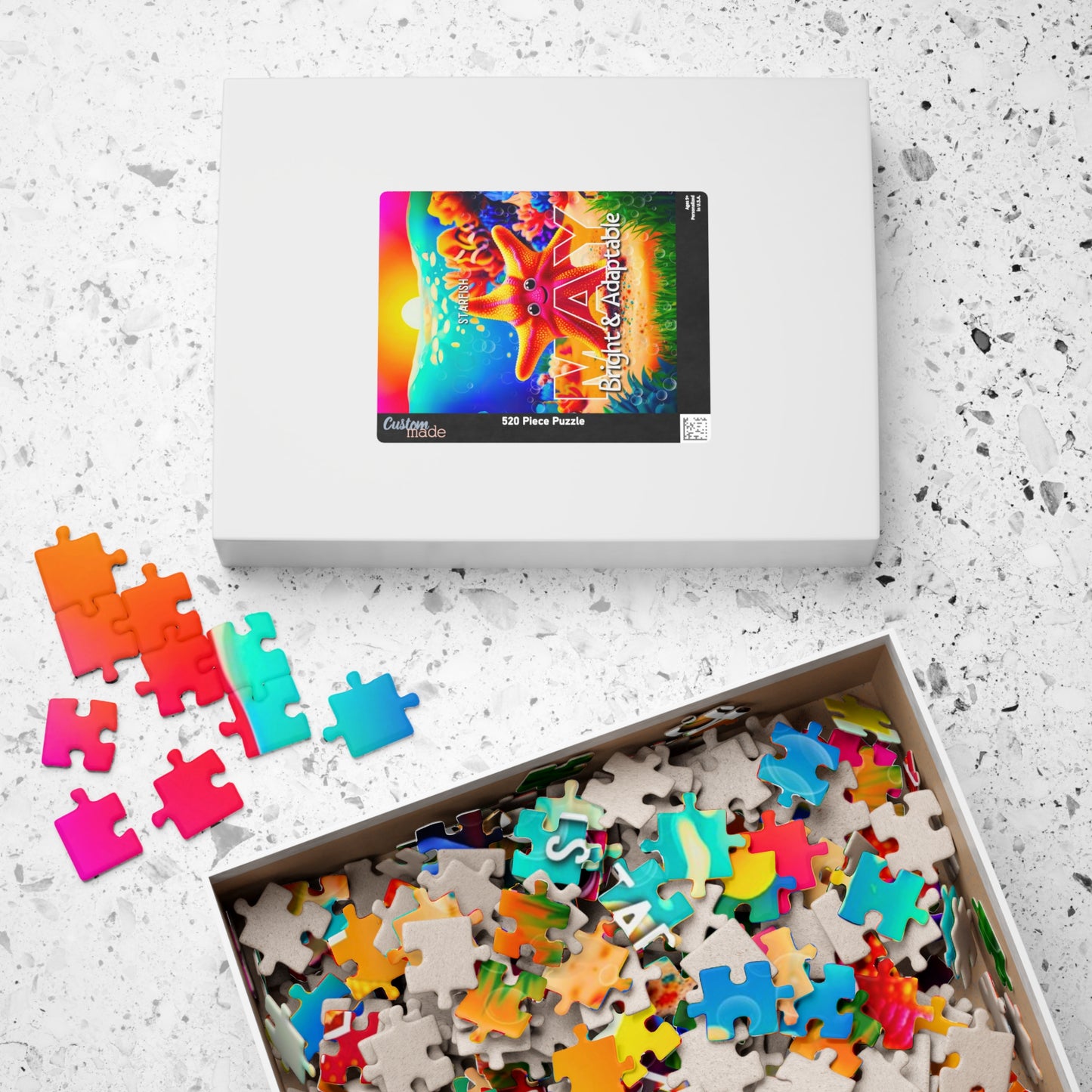 Kids birth month puzzle with colorful scattered pieces and boxed packaging on white surface