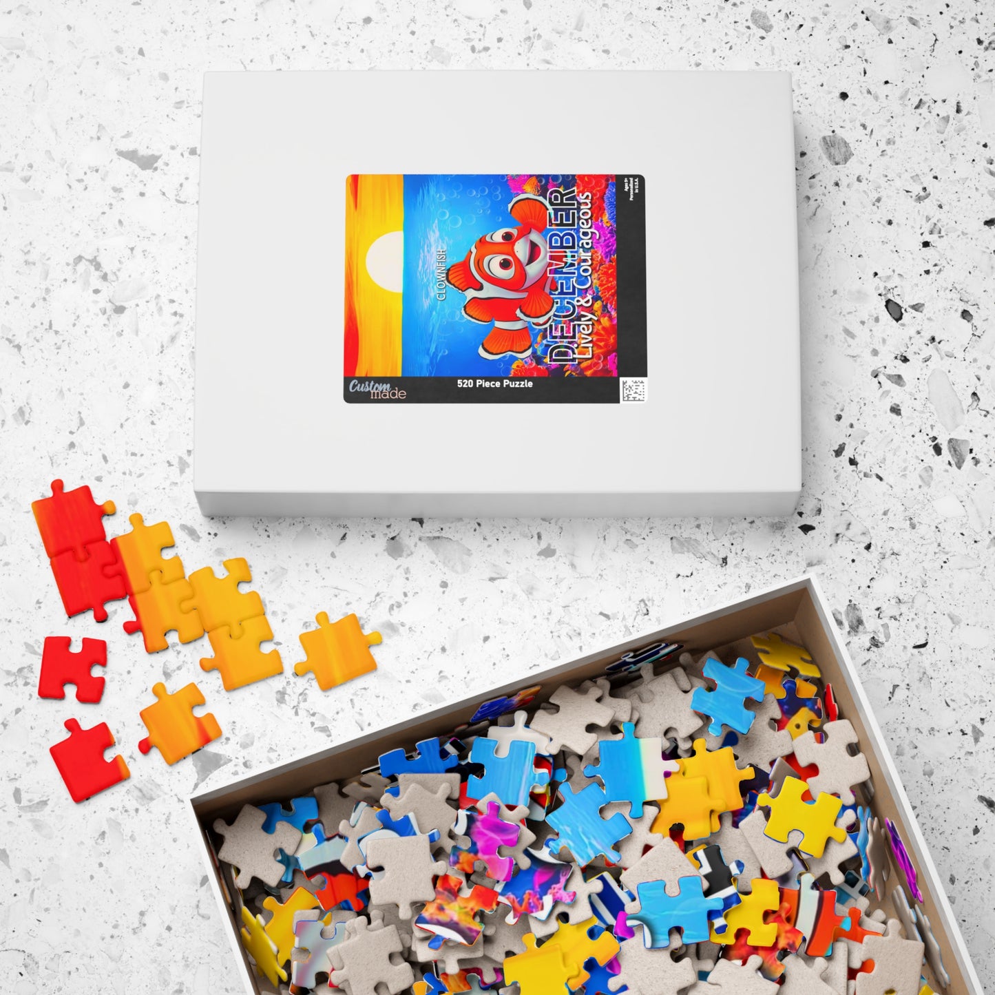 Kids birth month puzzle with colorful ocean fish design and scattered puzzle pieces