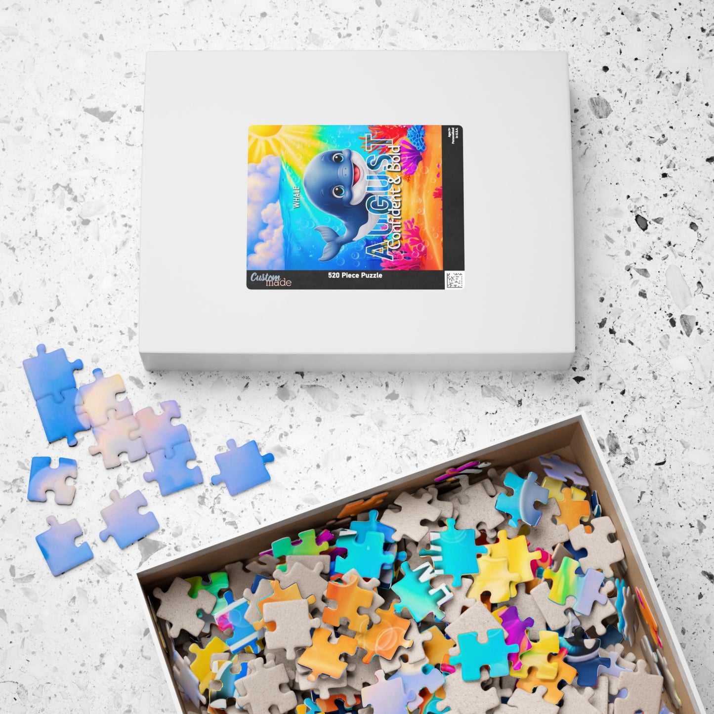 Kids birth month puzzle with colorful ocean-themed pieces and August design on box