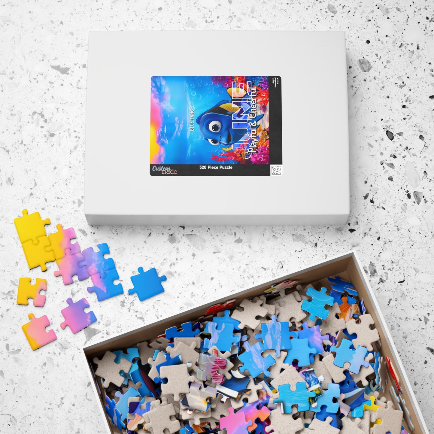 Kids birth month puzzle featuring colorful mixed puzzle pieces and a boxed set on white surface