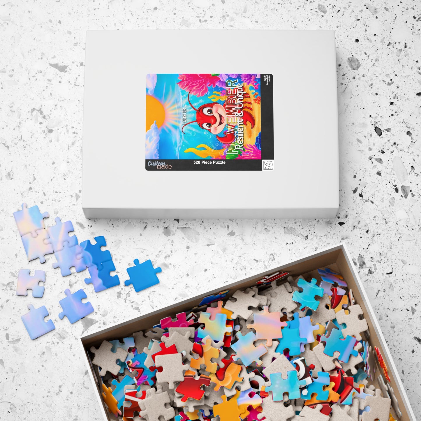 Kids birth month puzzle with colorful pieces and tropical crab design on the box
