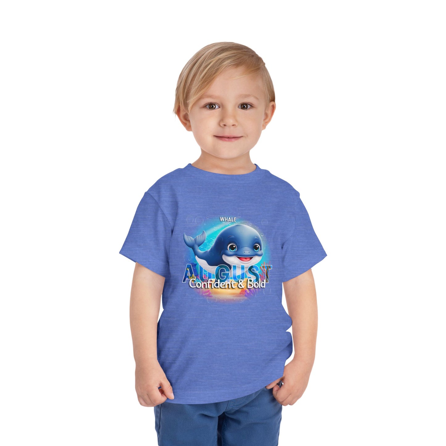 Young boy wearing kids birth month tshirt with August whale design confident and bold