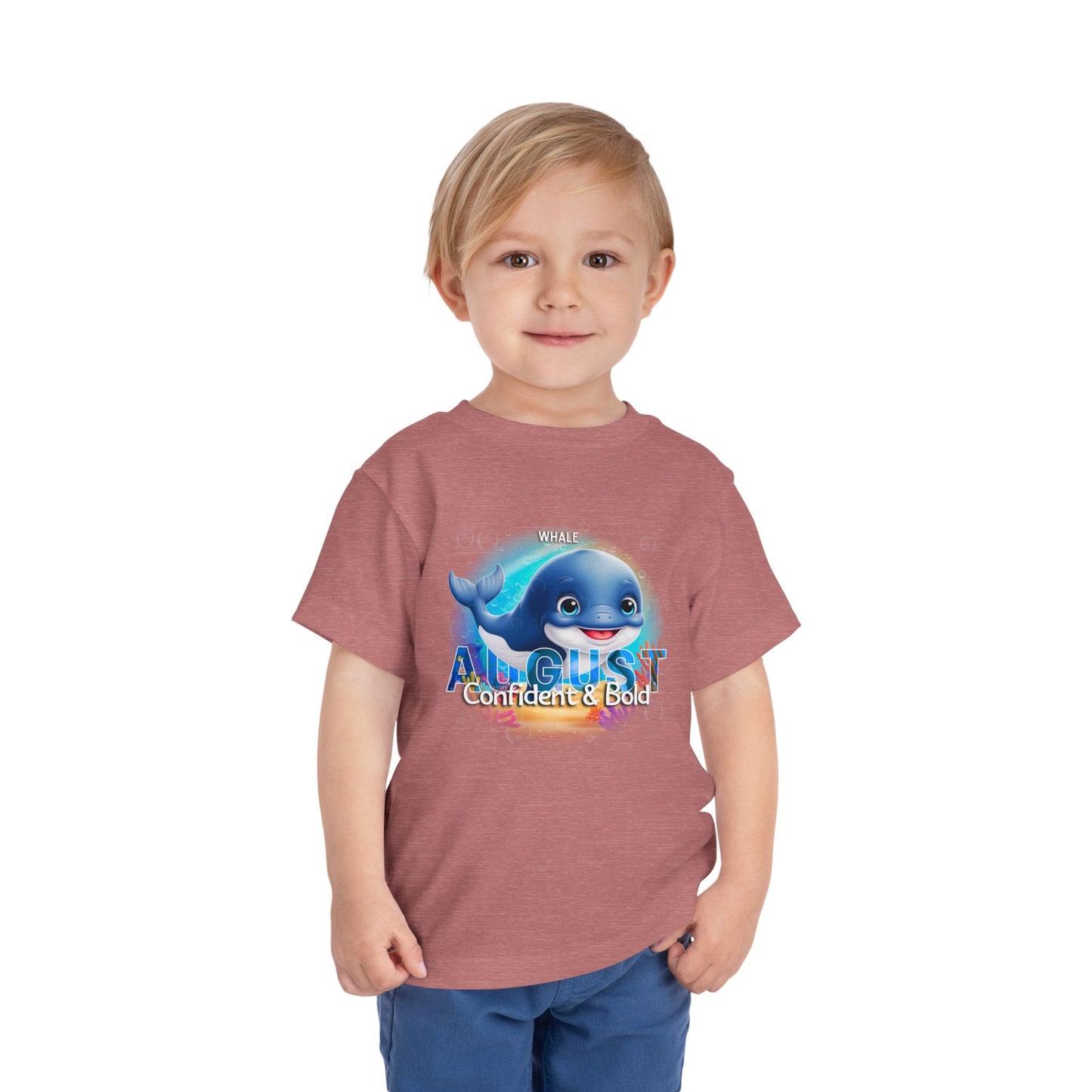 Kids birth month tshirt August with whale graphic worn by young boy in blue shorts