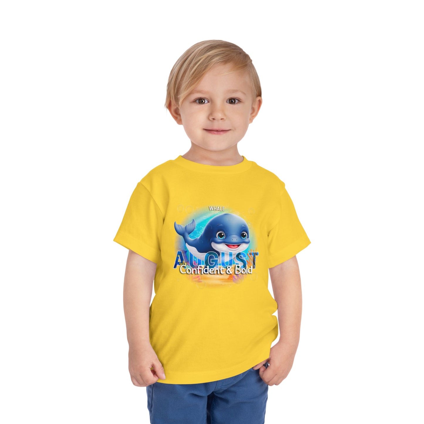Child wearing yellow kids birth month tshirt with August and blue whale graphic kids clothes