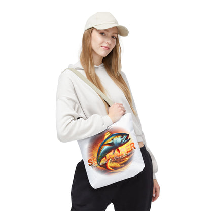 Birth month beach tote with colorful fish design carried by woman in casual outfit