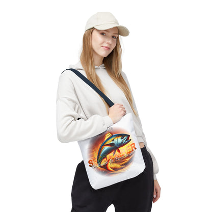 Birth month beach tote featuring colorful fish design worn by woman in casual outfit