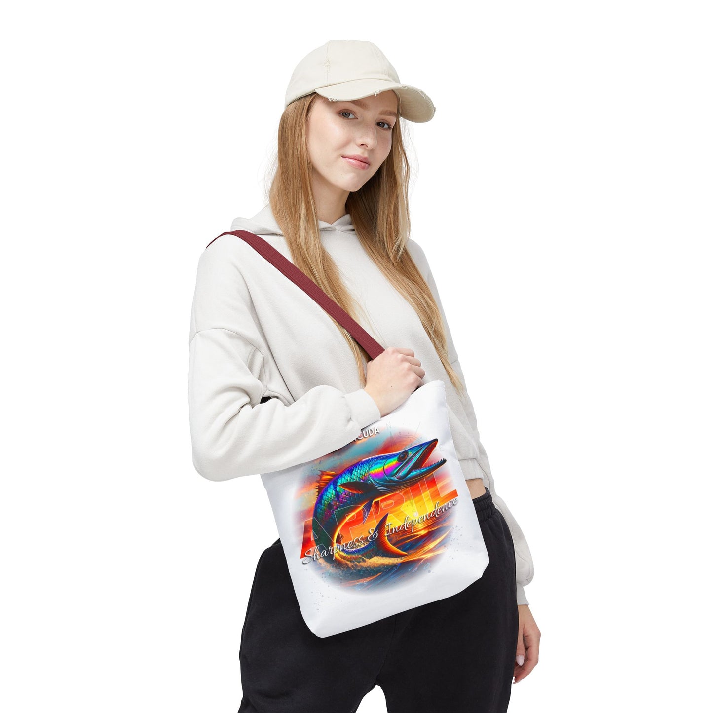Woman wearing a birth month beach tote with colorful fish design and maroon strap