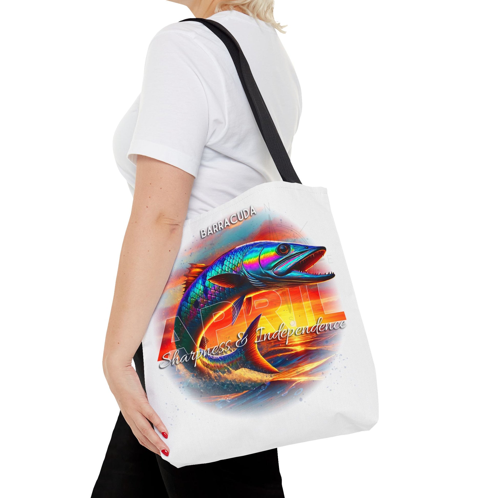Birth month beach tote with colorful barracuda design carried by woman in white shirt