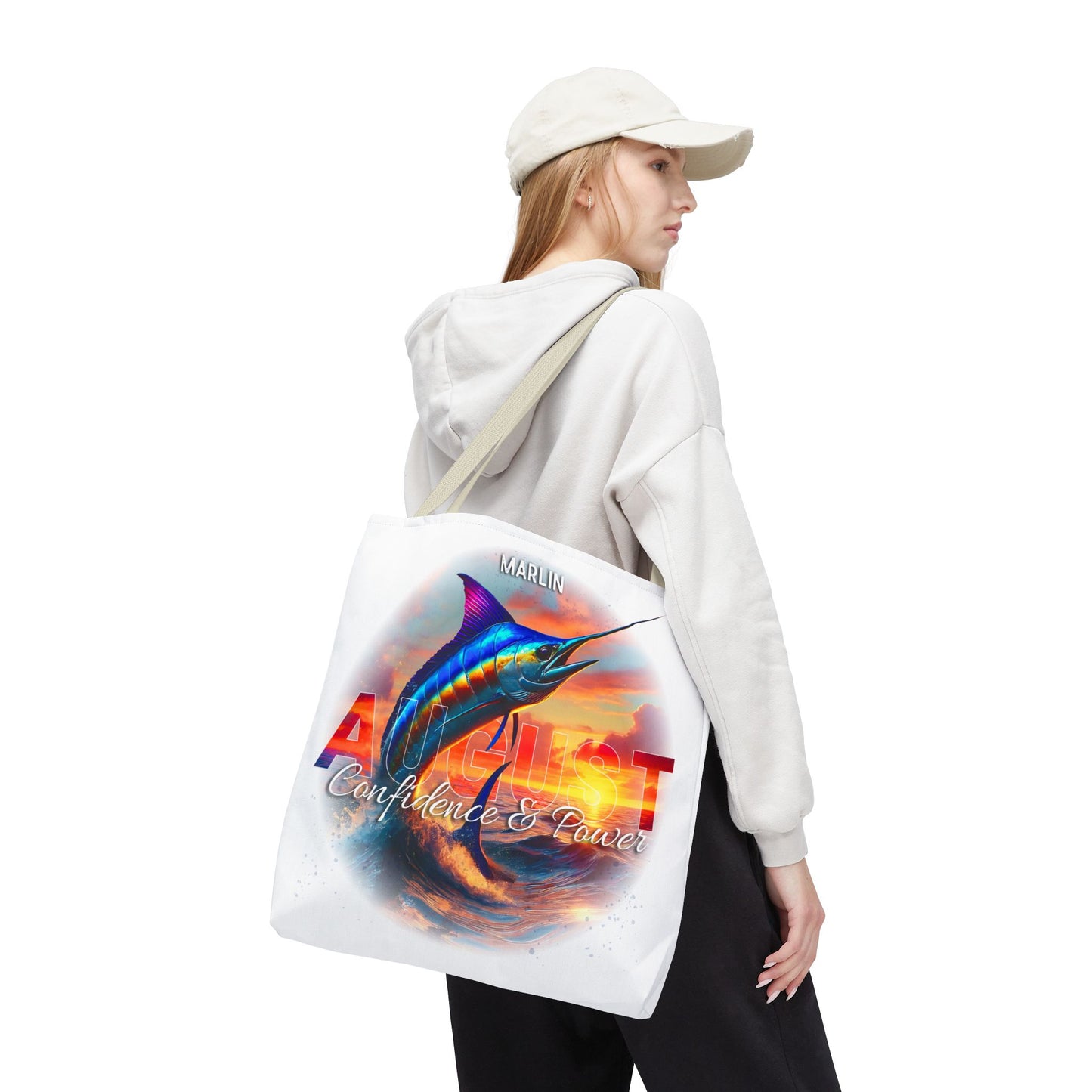 Birth month beach tote with vibrant marlin fish design and August text worn by woman