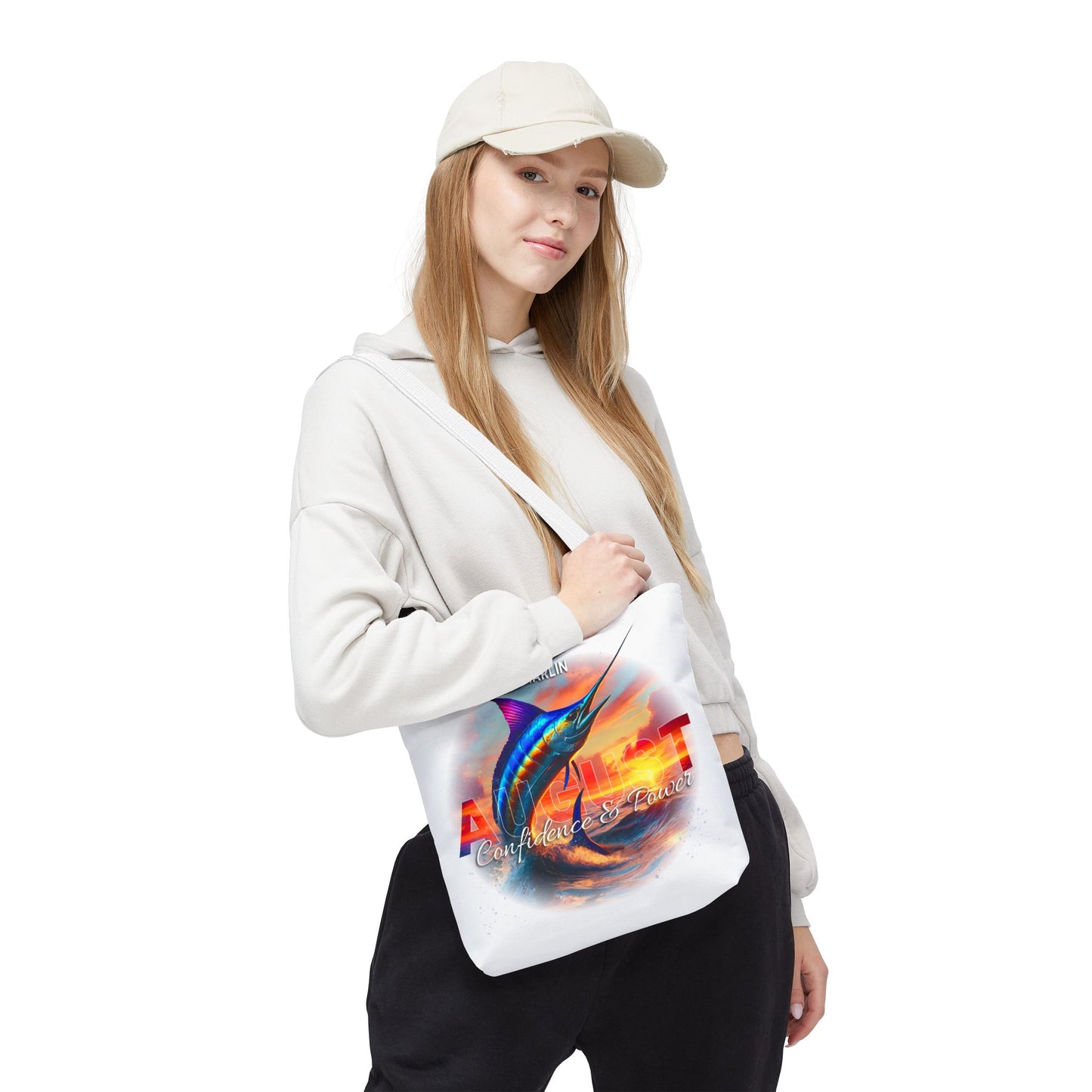 Woman wearing casual clothes carrying a birth month beach tote with colorful marlin print