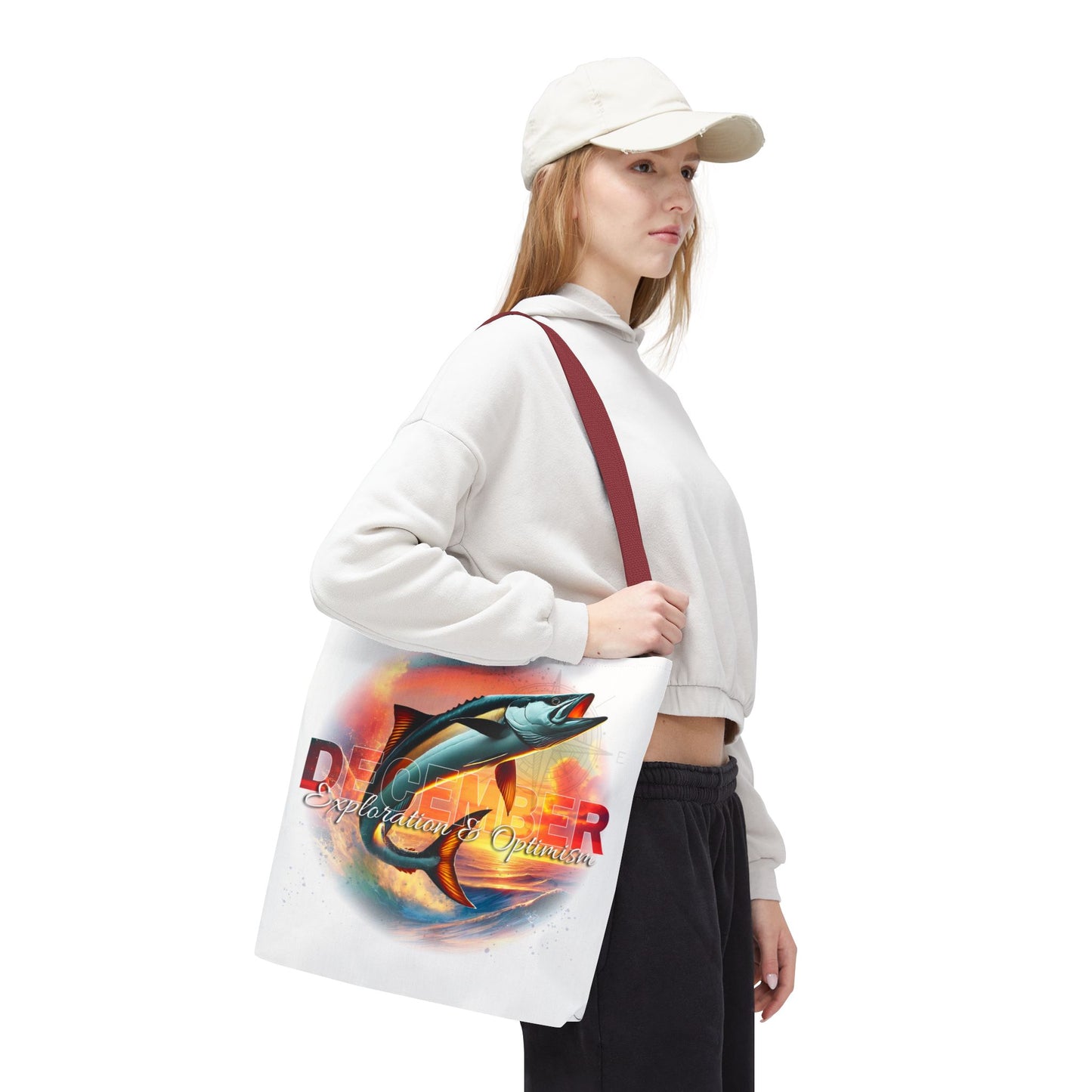 Birth month beach tote with colorful marlin fish design worn by woman in casual outfit