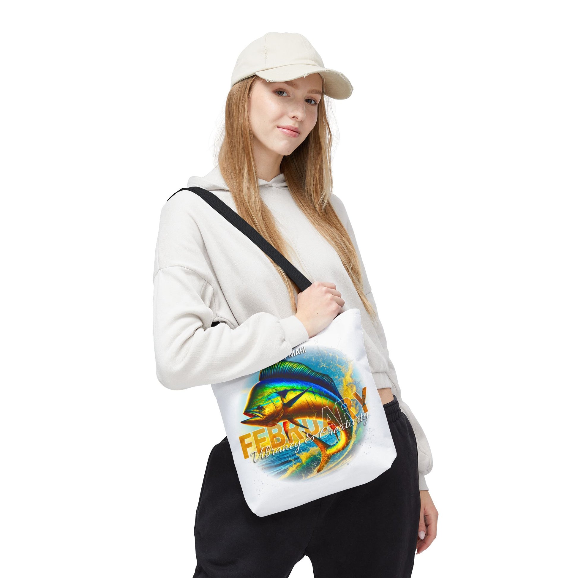 Birth month beach tote bag with colorful February fish design worn by woman
