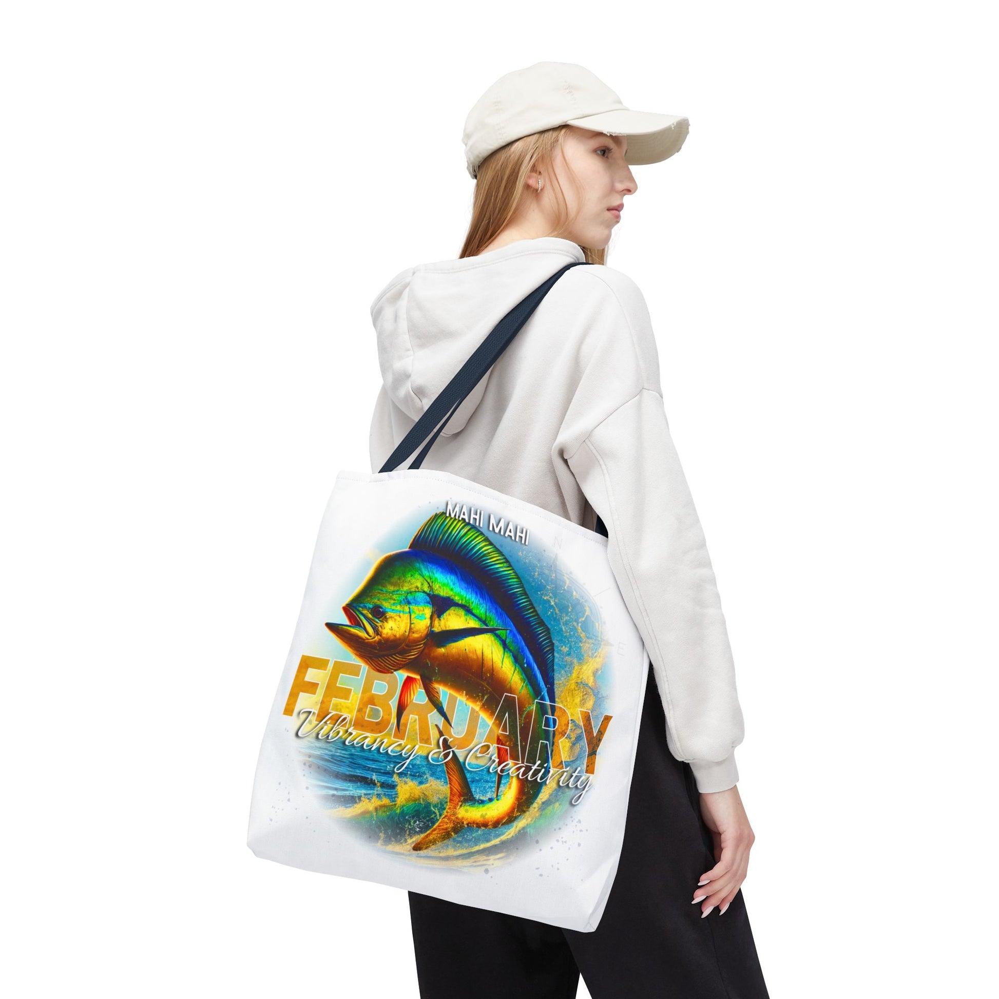 Birth month beach tote with colorful fish design and February text carried by woman in casual outfit