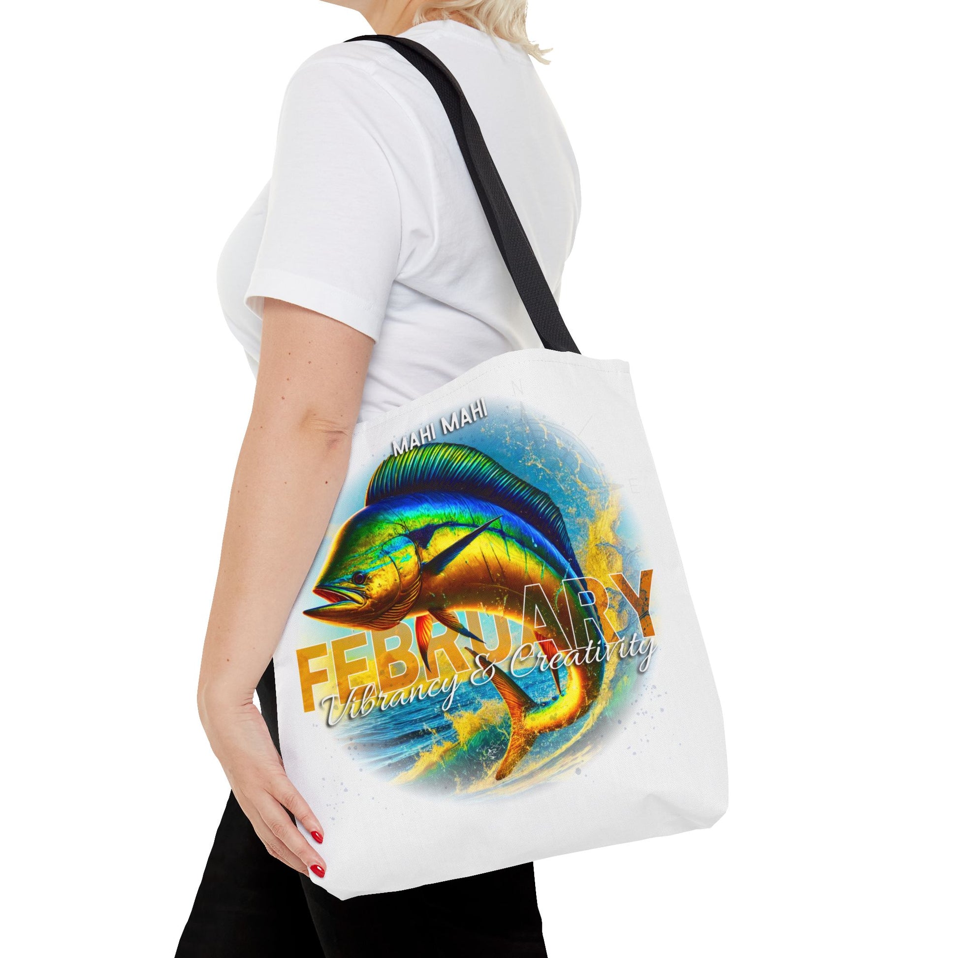 Birth month beach tote with colorful February Mahi Mahi fish design worn on shoulder