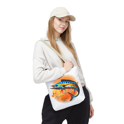 Birth month beach tote bag with colorful fish design carried by woman in casual outfit