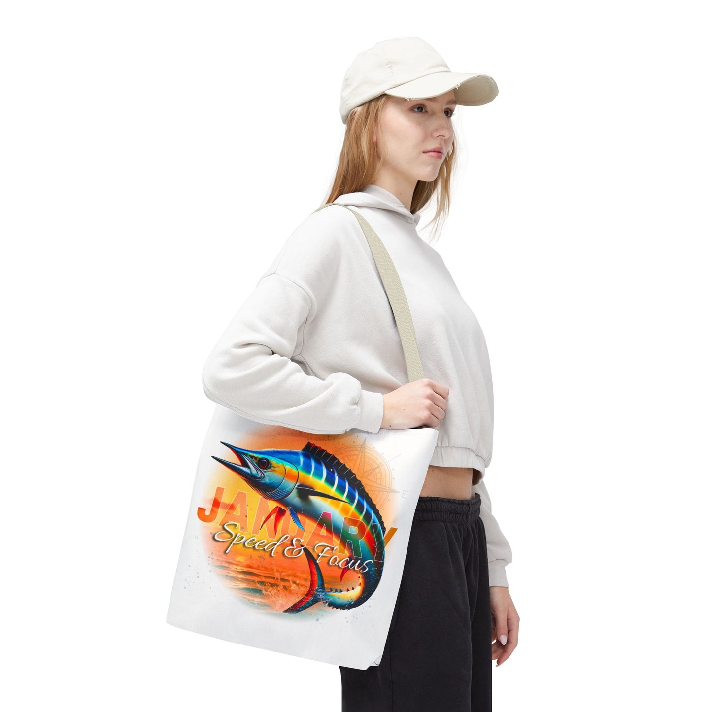 Woman carrying birth month beach tote with colorful marlin fish graphic and January text