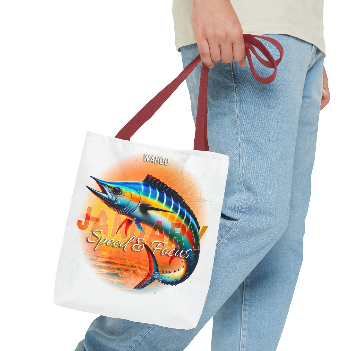 Birth month beach tote with colorful marlin fish design and red handles held by person