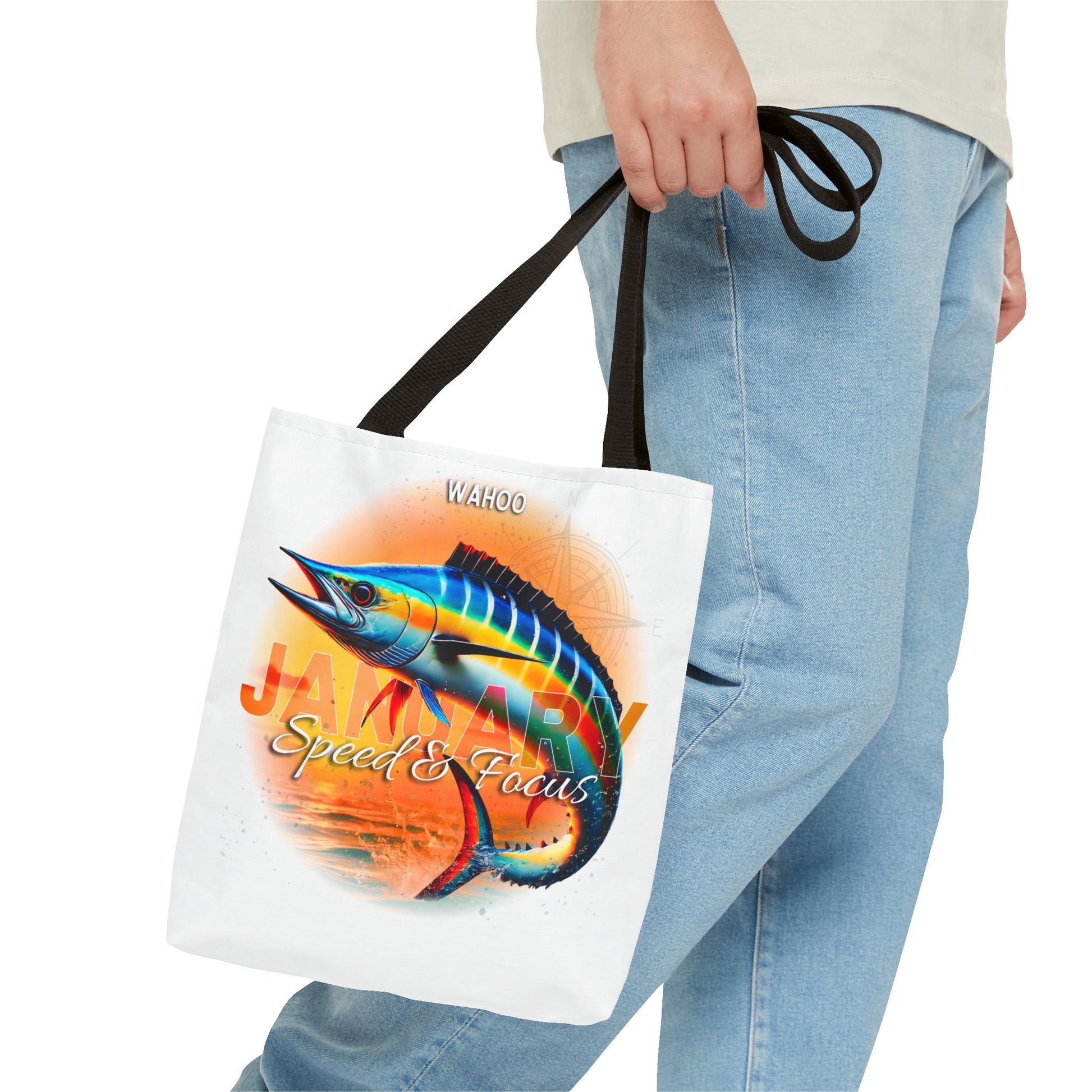 Birth month beach tote with colorful wahoo fish design and black handles held by person