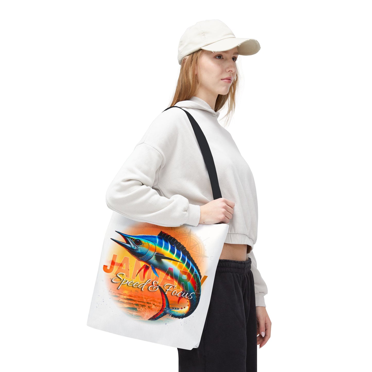 Woman carrying a birth month beach tote with colorful marlin fish design and January text