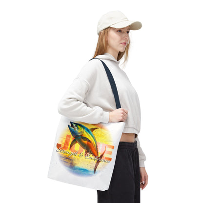 Woman carrying a birth month beach tote with colorful tuna fish design and strength theme