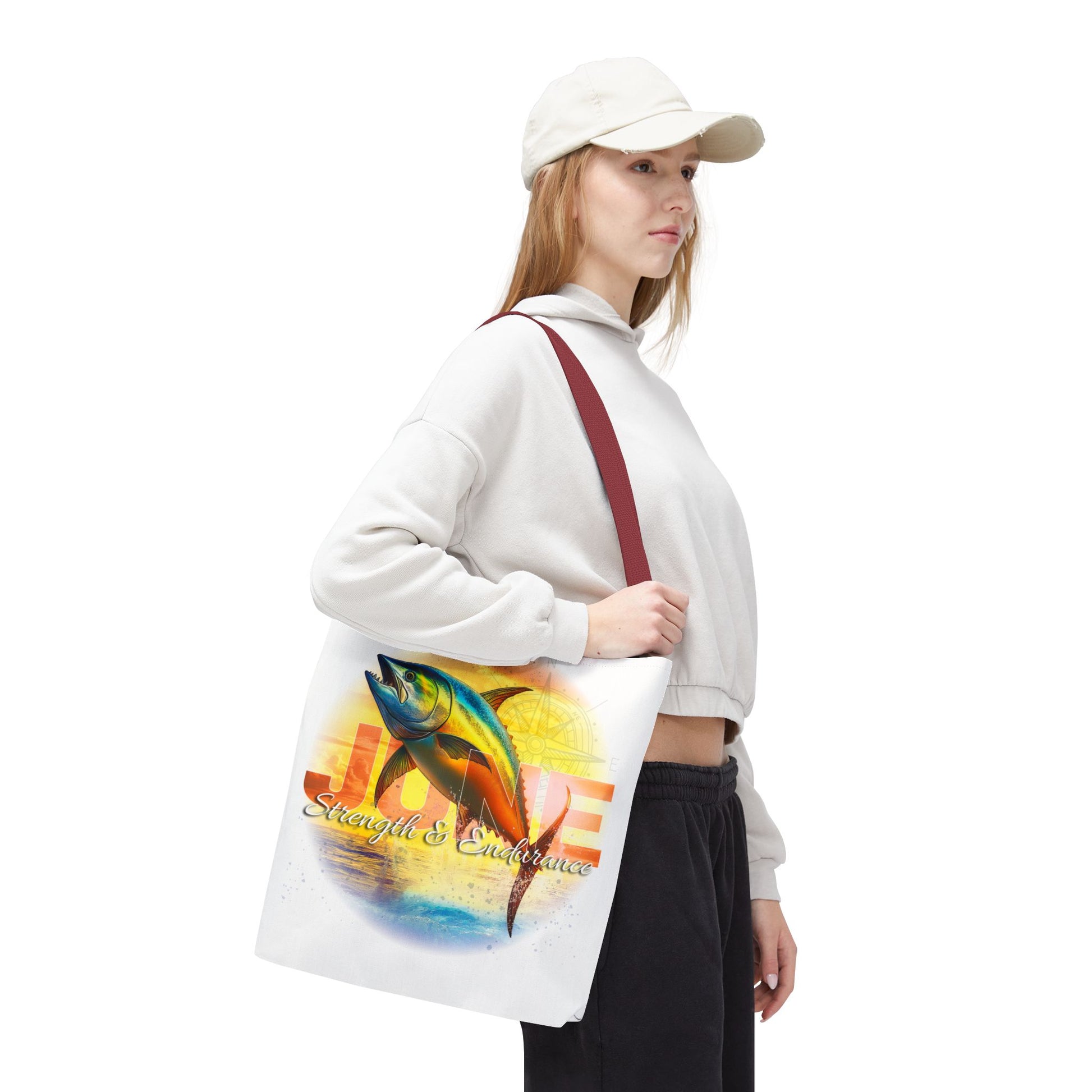 Woman carrying birth month beach tote with colorful fish and July design
