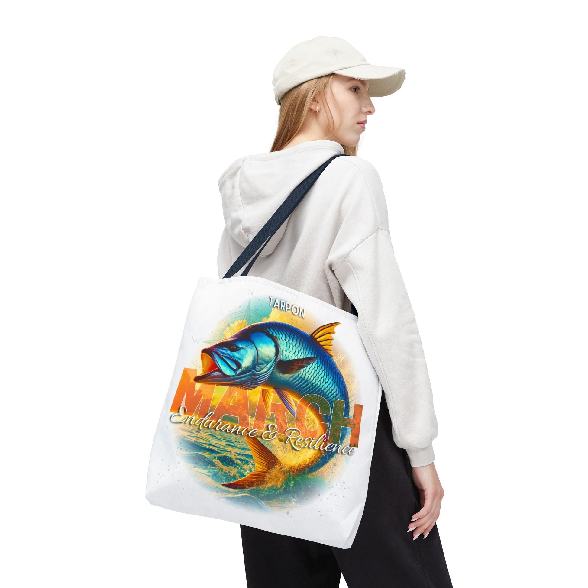 Birth month beach tote with colorful fish design worn by woman in casual attire