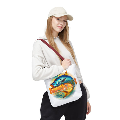 Woman wearing white birth month beach tote with colorful fish design and maroon strap