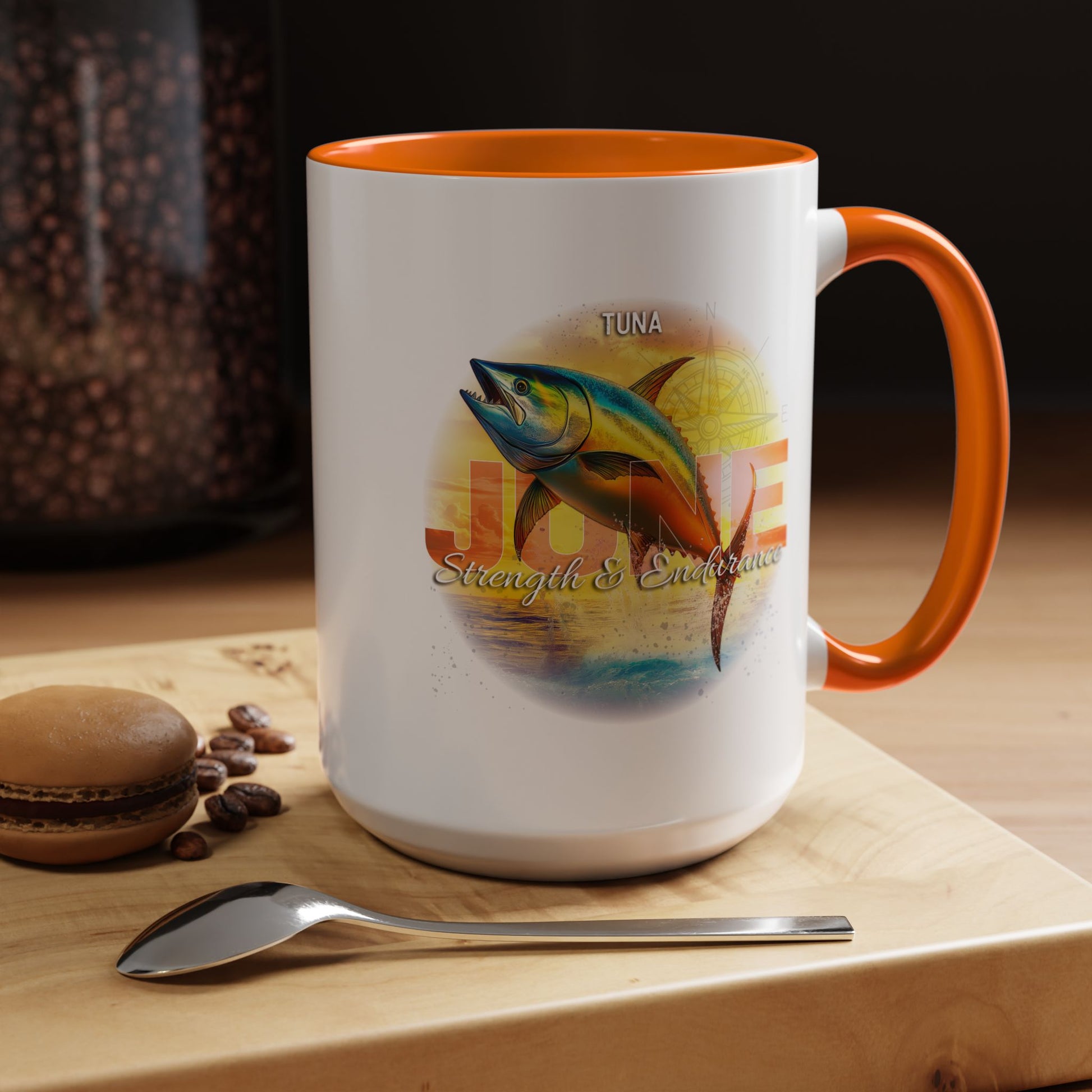 Birth month coffee mug with orange handle featuring tuna fish design and strength endurance text