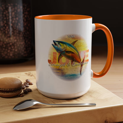 Birth month coffee mug with orange handle featuring tuna fish design and strength endurance text