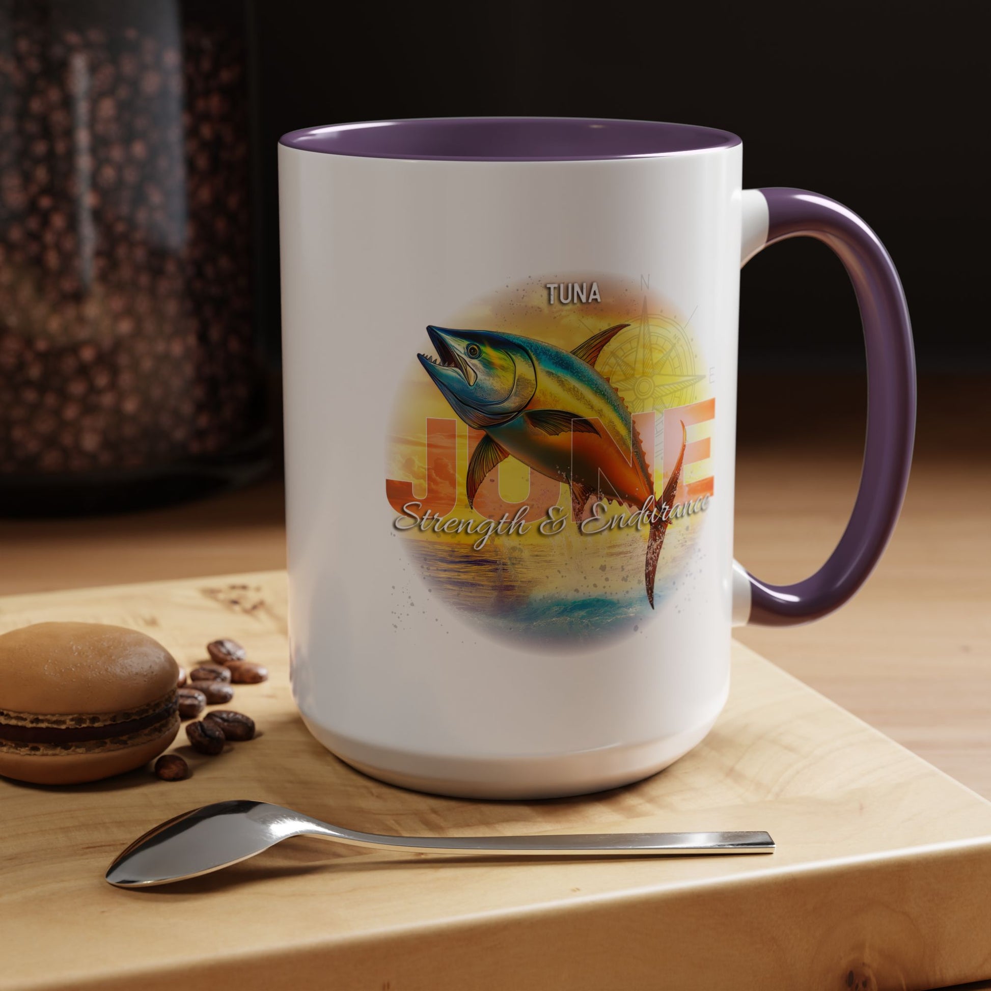 Birth month coffee mug with tuna fish design and purple handle on wooden table