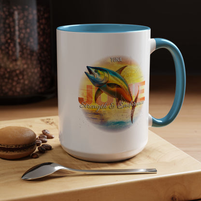 Birth month coffee mug with tuna fish design and blue handle on wooden table