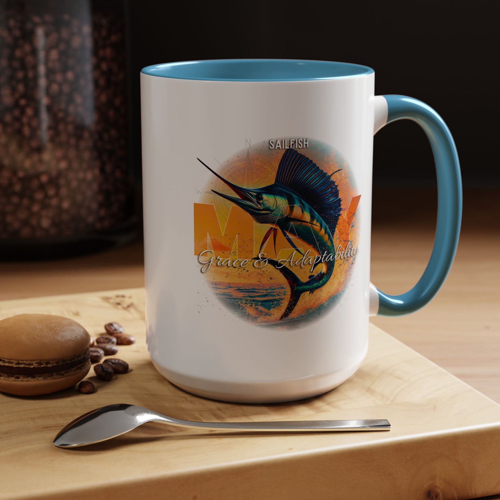 Birth month coffee mug featuring a colorful sailfish design with blue handle and interior