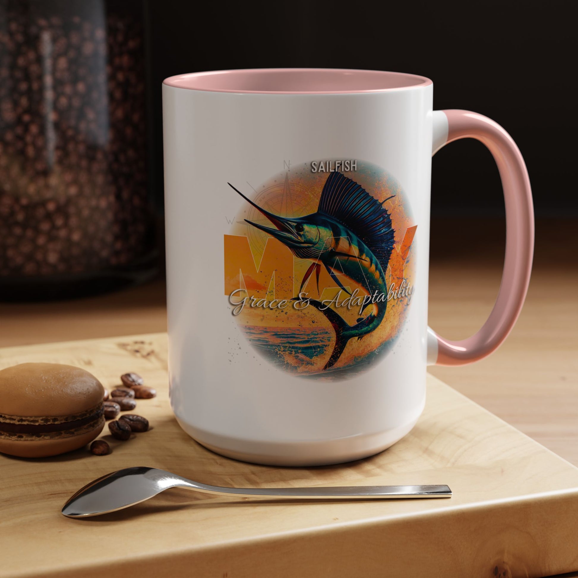 Birth month coffee mug featuring a colorful sailfish design with pink handle and rim