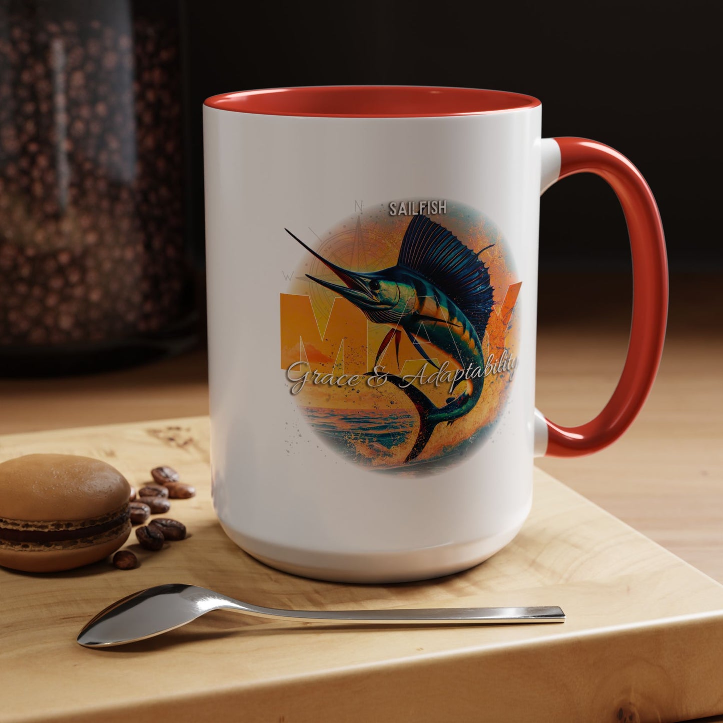 Birth month coffee mug with colorful sailfish design and red handle and interior