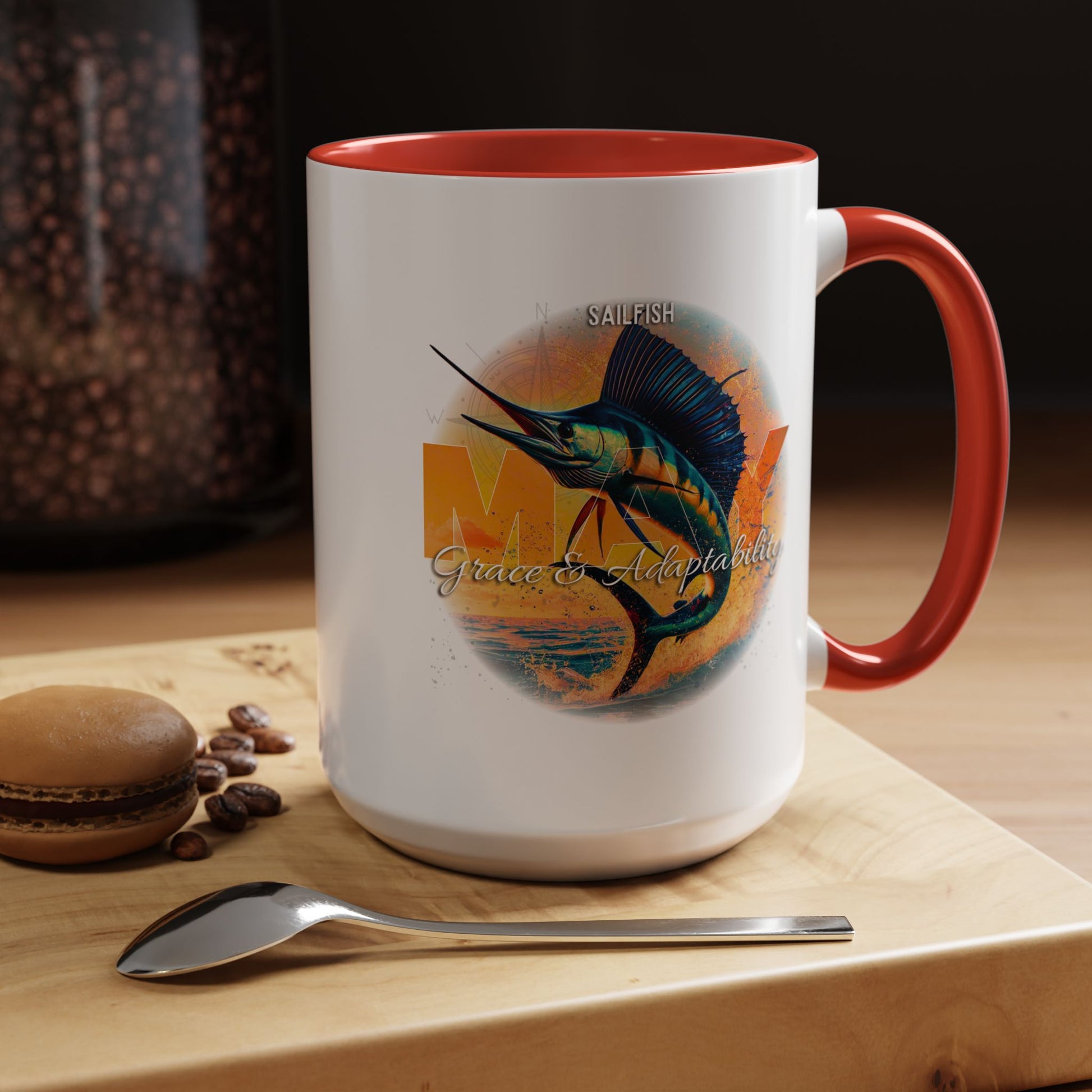 Birth month coffee mug with colorful sailfish design and red handle and interior