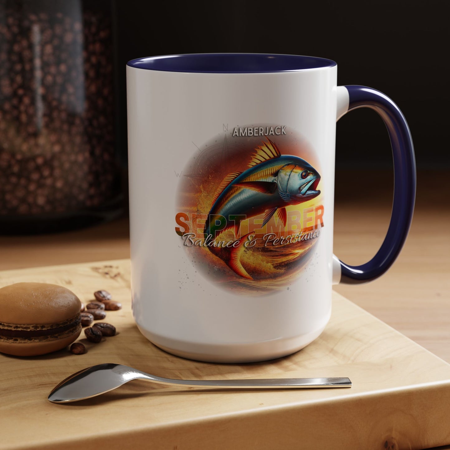 Birth month coffee mug with September fish design and navy blue handle on wooden surface