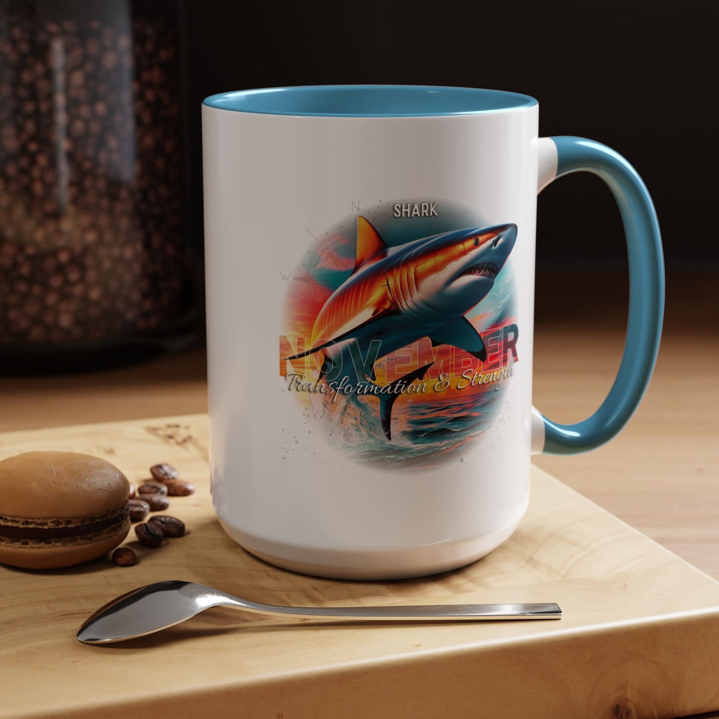 Birth month coffee mug featuring a colorful shark design with blue handle and interior