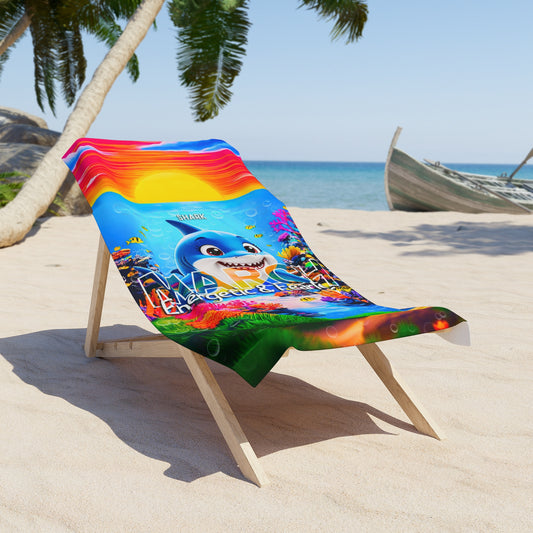 Colorful birth month kids beach towel with shark design on wooden lounge chair at the beach