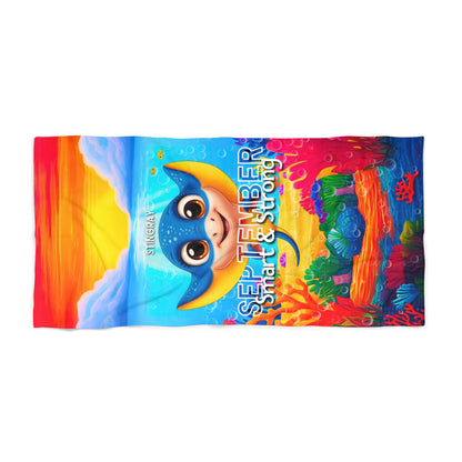 Birth month kids beach towel with colorful stingray design and September text 
