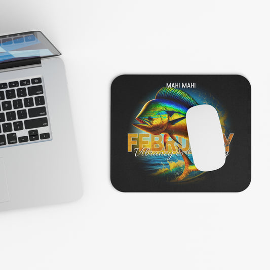 February birth month mouse pad with vibrant Mahi Mahi fish design by Printify next to laptop
