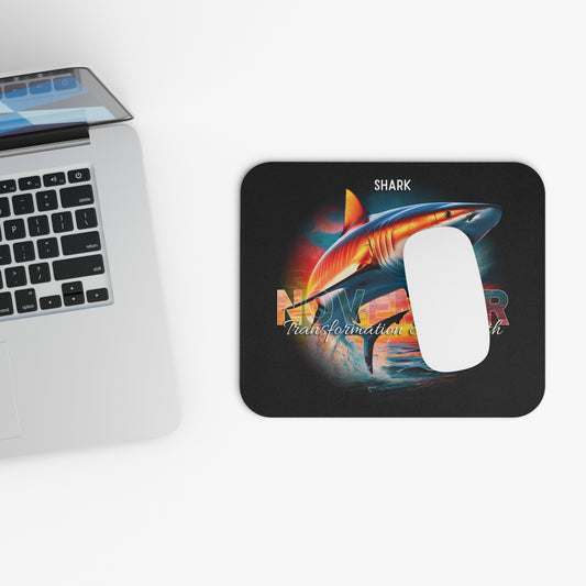 Birth month mouse pad featuring a colorful shark design next to a silver laptop on a white desk