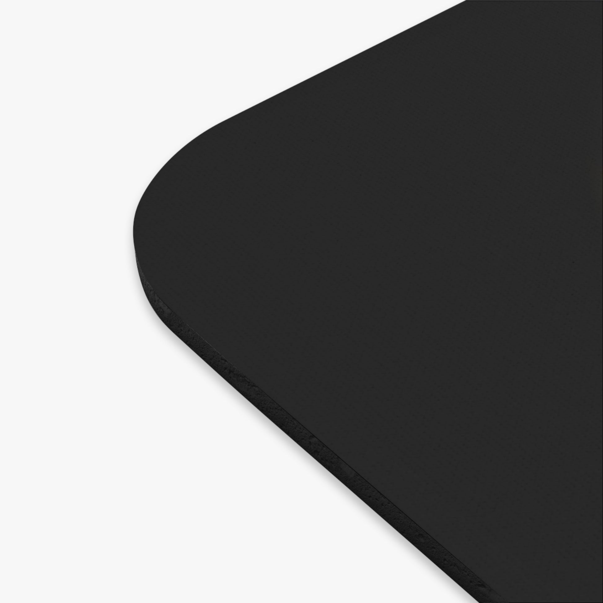 Close-up of black birth month mouse pad corner with smooth rounded edges for home decor 
