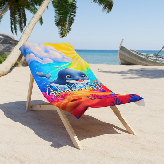 Colorful birth month kids beach towel with whale design and August text on wooden beach chair