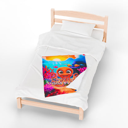 Colorful kids birth month blanket featuring a February octopus design on a wooden bed