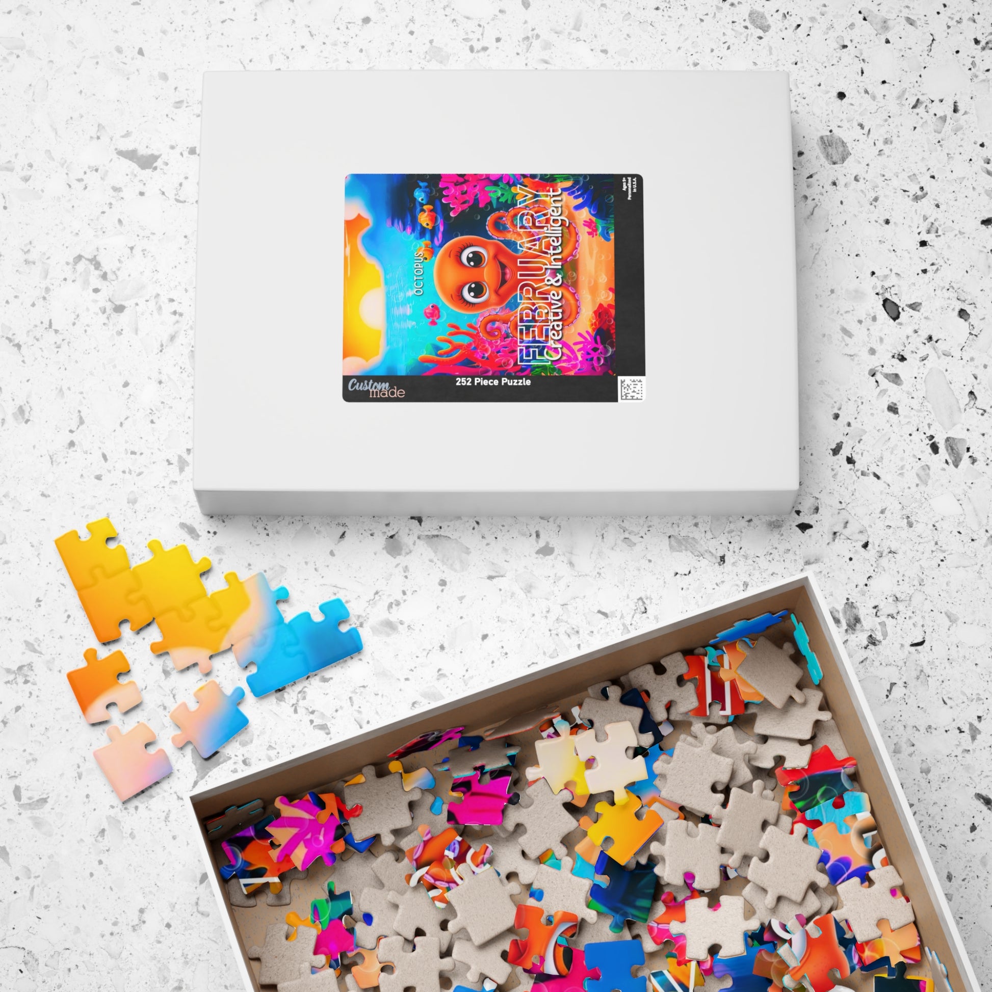 Kids birth month puzzle with colorful cartoon sea creature for February in box and loose pieces
