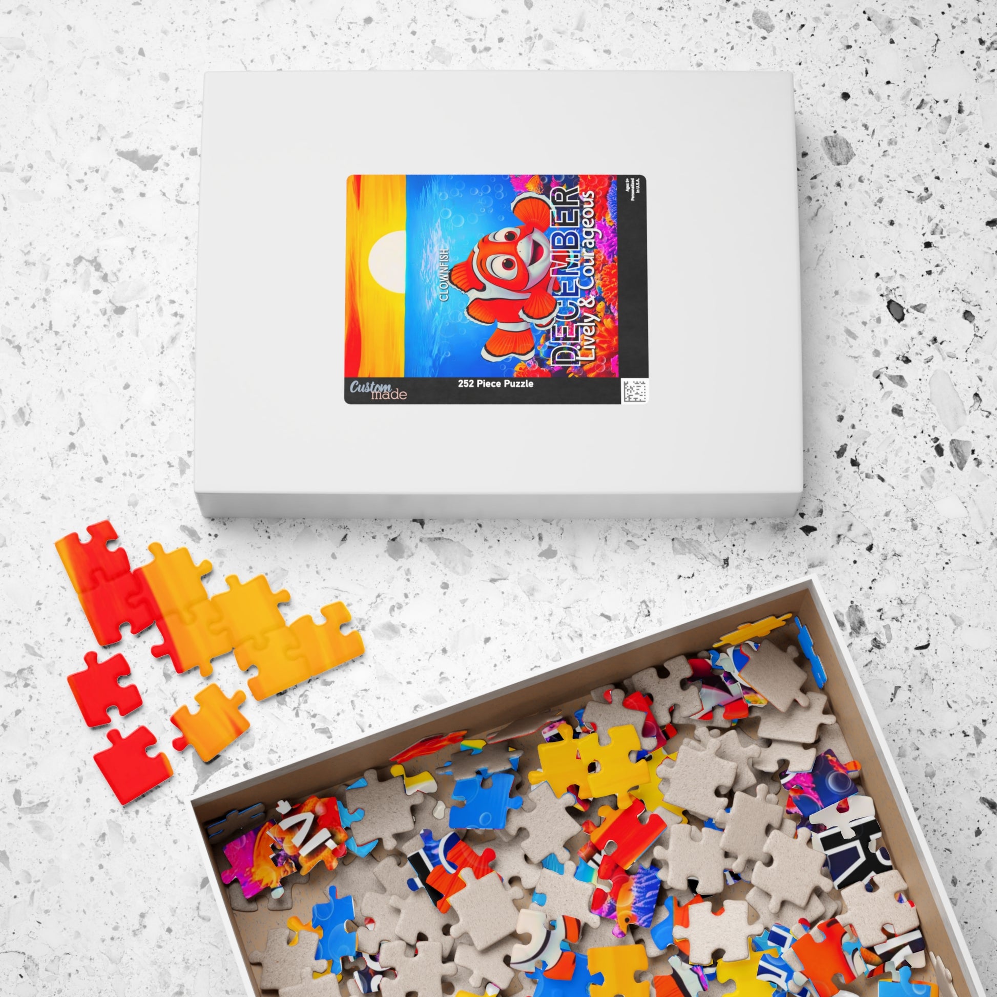 Kids birth month puzzle featuring colorful ocean and clownfish design in 252 pieces