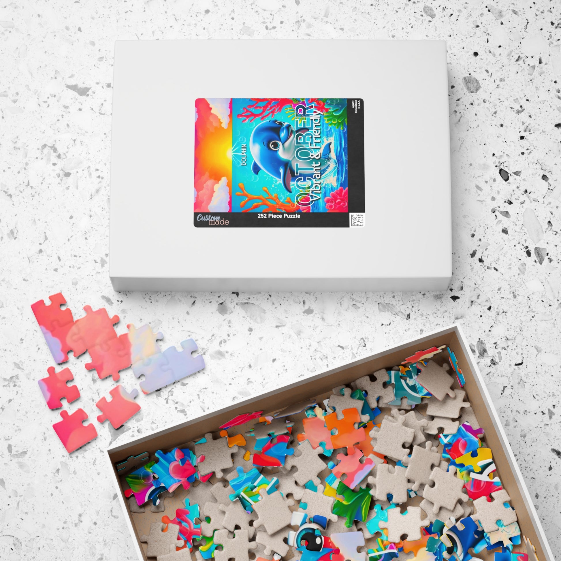 Kids birth month puzzle with colorful ocean-themed pieces and dolphin image in box